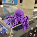 3D printed purple Octopus sitting on one of the Kalamazoo College 3D printers.